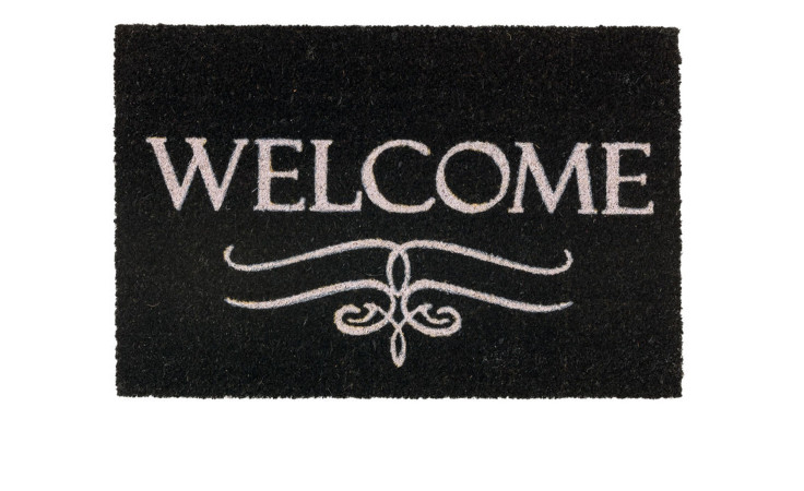 Die Astra Fußmatte Coco Style 40 x 60 cm zeichnet sich durch ein WELCOME-Design und dekorative weiße Akzente aus natürlichen Materialien aus.