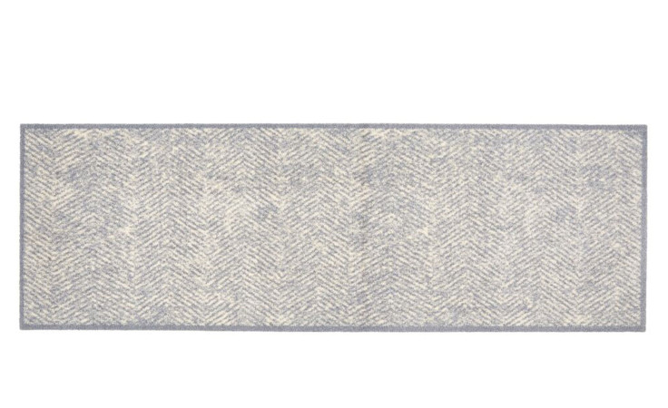 Astra Fußmatte Miabella 50x150 cm: hellgraues und cremefarbenes Fischgrätmuster, strapazierfähiges Polyamid für dauerhaften Stil.