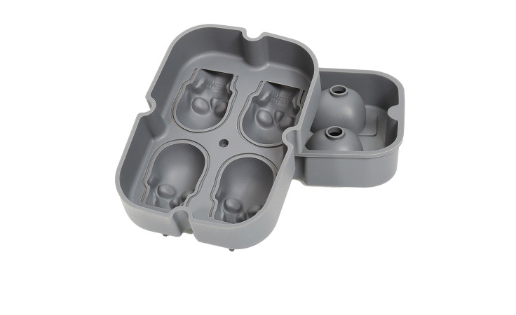 Graue Eiswürfelform Cranio aus Silikon mit kompakten Maßen; formt hippopotamusförmige Köpfe.