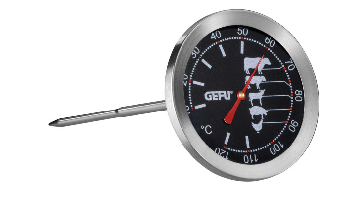 Das GEFU Bratenthermometer Messimo ist silberfarben mit schwarzem Zifferblatt, roter Nadel und fleischähnlichen Symbolen.