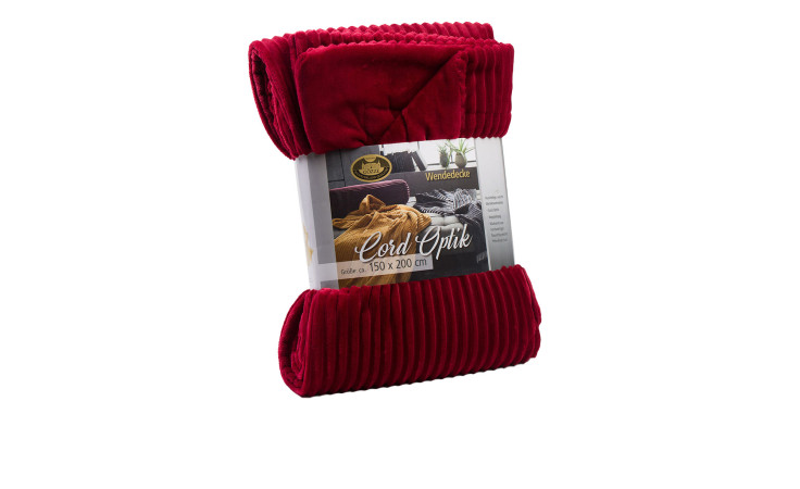 Eine gefaltete Gözze-Wohndecke Cord 150 x 200 cm mit Verpackung mit Produktangaben.