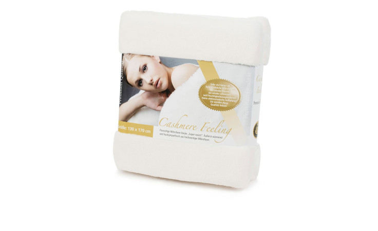 Eine verpackte Gözze Wohndecke Premium Cashmere Feeling 130x170 cm mit einem Etikett, das eine darauf liegende Frau zeigt.