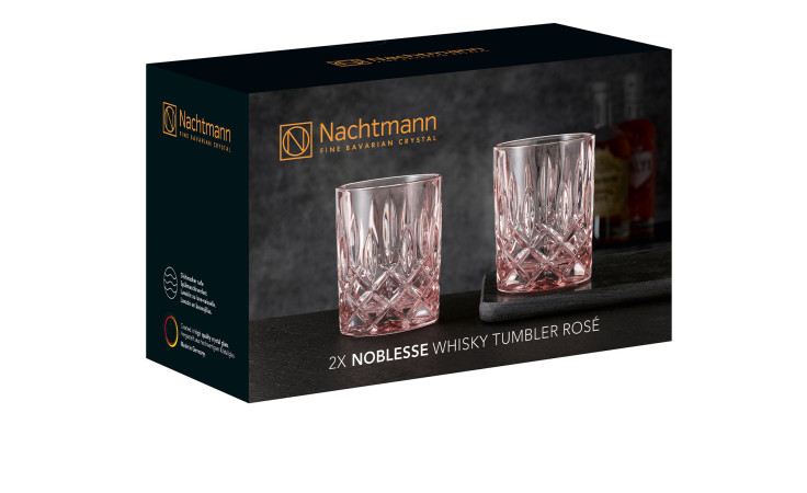 Whiskyglas-Set Noblesse 2-tlg. mit zwei roséfarbenen Bechern und rosa Glasdekoration auf der Kartonverpackung.