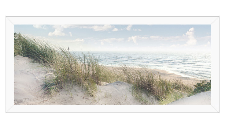 Pro-Art Rahmenbild Ostseeküste 60x130 cm: Sanddünen, hohes Gras und sanfte Wellen unter einem teilweise bewölkten Himmel.