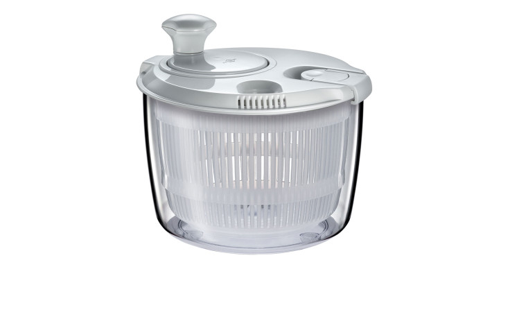 Die Küchenprofi Salatschleuder Mini 2,5 l ist eine transparente Salatschleuder mit einem weißen Deckel, Griff und Korb.