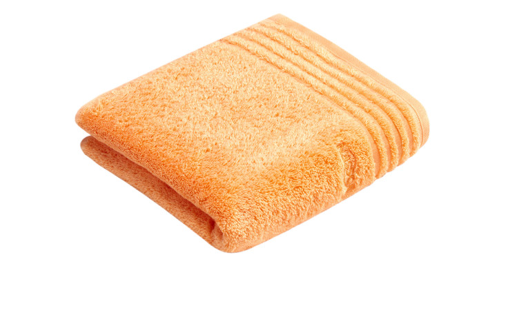 Gefaltetes orangefarbenes Vossen Handtuch Vienna Style Supersoft 50 x 100 cm mit gerippten Details auf weißem Hintergrund.