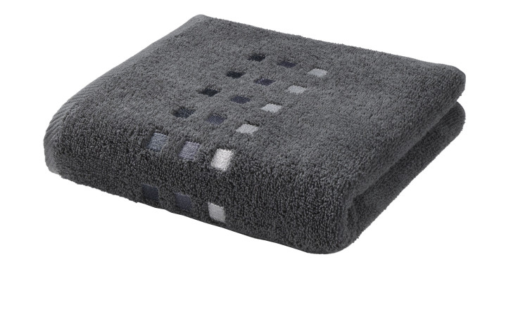 Das Casa Nova Frottee-Handtuch Quattri 50 x 100 cm hat dezente graue und weiße quadratische Akzente.