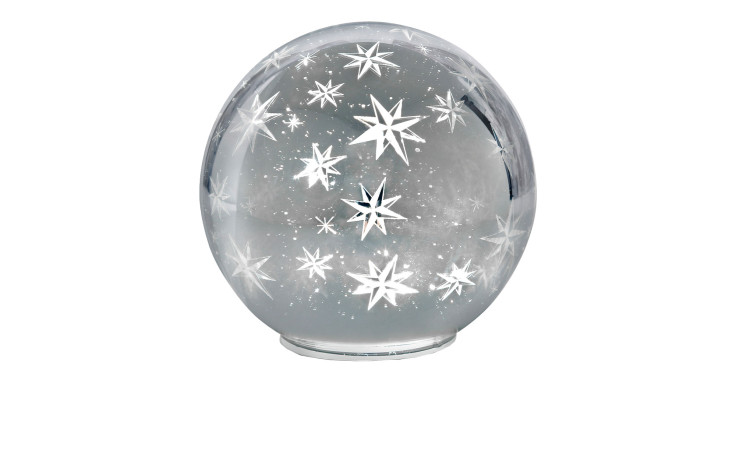 Eine 15 cm große runde "Kugel" mit weißen Sternmustern und einem wolkigen Inneren, das an eine dekorative Schneekugel erinnert.