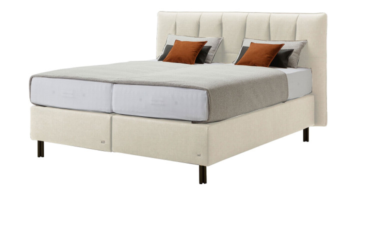 Komfort-Boxspringbett Tokyo in einem beigen Bezug in Kunstleder