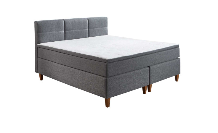 Boxspringbett Kansas in der Farbe Grau mit einem weißen Topper