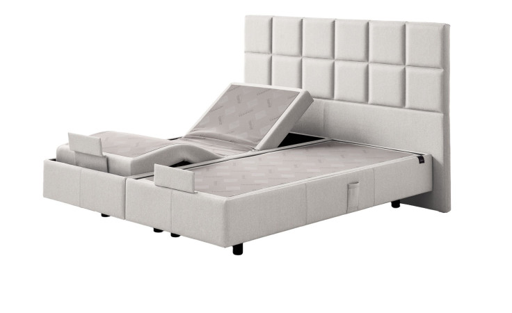 Boxspringbett Discovery Classic in einem Bezug in White Fabric in Stoff. Schräge Seitenansicht
