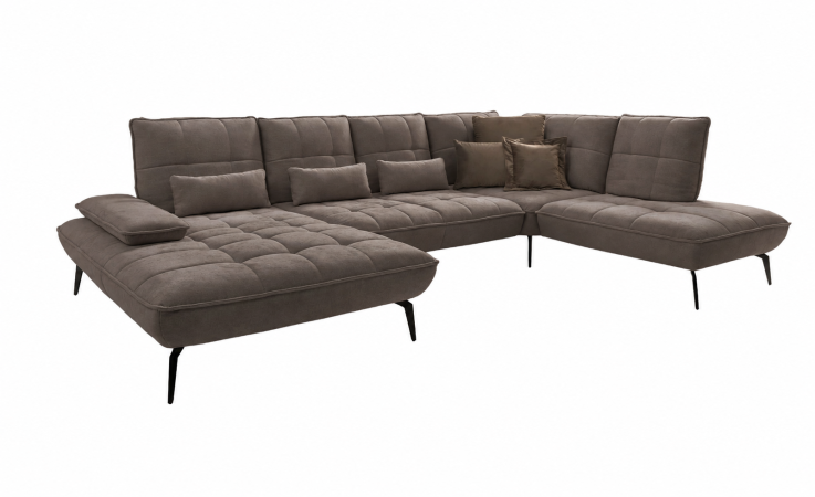 Komfort-Wohnlandschaft „vito Ticona Plus“ von Vito: graues L-förmiges Sofa mit gesteppten Kissen, Sitztiefenverstellung, schwarze Füße.
