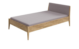 Traumliege Stiene in Eiche Massivholz mit einem Stoffkopfteil in Steingrau.