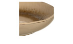 Teilansicht der Leonardo Teller Matera 20,7 cm, einer flachen, runden, beigen Schale mit glänzender, strukturierter Innenseite.