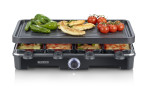 Der SEVERIN Raclette-Grill von Severin in Schwarz mit Hähnchen, Paprika und Tomaten; darunter Gemüse- und Käsetabletts.