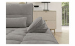 Graues Vito Ticona Plus-Sofa mit kapuzenförmigen Kissen und rechteckigen Zierkissen.