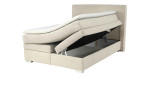 Boxspringbett Alice in der Farbe Beige mit geöffnetem Bettkasten rechts