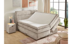 Boxspringbett Quinto Mix in der Farbe Beige in einem Zimmer mit geöffnetem Bettkasten