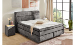 Boxspringbett Quinto Mix in der Farbe Grau in einem Zimmer