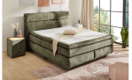 Boxspringbett Quinto Mix in der Farbe Hellgrün in einem Zimmer