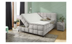 Boxspringbett Mayra in der Farbe hellgrau, in einem Raum stehend mit geöffneten Bettkasten