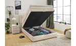Boxspringbett Antonia de Luxe in der Farbe Beige im Schlafzimmer mit geöffnetem Bettkasten