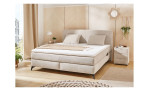 Boxspringbett Kaprun mit einem Chenillebezug in der Farbe Beige, in einem Raum stehend
