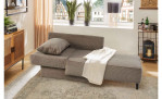 Schlafsofa Ravensburg in der Farbe Taupe in Liegeform in einem Zimmer