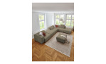 Komfort-Ecksofa plano|FORM Toronto, in der Farbausführung Olive, in einem Raum stehend, ohne Kissen