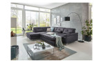 Komfort-Ecksofa plano|FORM Marbella, in der Farbausführung Grau, in einem Raum stehend mit der Schlaffunktion