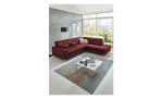 Komfort-Ecksofa plano|FORM Marbella, in der Farbausführung Wine, in einem Raum stehend