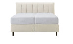 Basis-Boxspringbett Tokyo in einem Beigen Bezug aus Kunstleder. Frontansicht