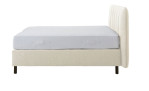 Basis-Boxspringbett Tokyo in einem Beigen Bezug aus Kunstleder. Seitenanansicht