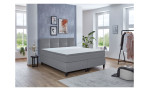 Boxspringbett Susanna, in der Farbausführung Grau, in einem Raum stehend ohne Deko