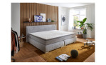 Boxspringbett Family, in der Farbausführung Grau, in einem Raum stehend ohne Deko