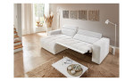 Wohnlandschaft Leona in Weiß mit Relaxfunktion und Ottomane links, fotografiert im modern eingerichteten Raum.