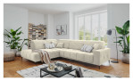 Wohnlandschaft Luan in Creme mit Cord-Optik, inszeniert auf gemustertem Teppich mit schwarzem Couchtisch und Stehlampe.