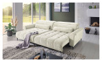 Komfort-Wohnlandschaft Lilly in einem cremefarbenen Cordstoff mit zwei Zierkissen und gezeigter Funktion. Auf einem dekorierten Hintergrund.