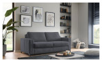 Modernes Wohnzimmer mit einem dunkelgrauen „Basis“-Schlafsofa „Pickering“ von Hukla, Kunstwerken, Regalen, einer Pflanze und einem niedrigen Tisch.