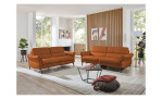 Komfort-Sitzgruppe MONDO Comfort Magul, in der Farbausführung Cognac, in einem Raum stehend