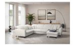 Modernes Wohnzimmer mit der Vito Komfort-Wohnlandschaft „Wisom“, einer Stehlampe, einer Pflanze und zwei gerahmten Drucken im Format 85 cm.