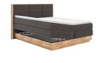 Boxspringbett MONDO NATUR Incana in einem Stoffbezug in Charcoal und einem Sichtholzrahmen in Eiche. Mit geöffneten Bettkasten