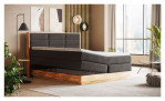 Boxspringbett MONDO NATUR Incana in einem Stoffbezug in Charcoal und einem Sichtholzrahmen in Eiche. Mit geöffneten Bettkasten