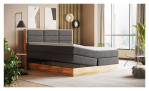 Boxspringbett MONDO NATUR Incana in einem Stoffbezug in Dark Grey und einem Sichtholzrahmen in Eiche. Mit geöffneten Bettkasten