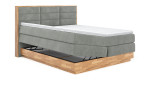 Boxspringbett MONDO NATUR Incana in einem Stoffbezug in Desert und einem Sichtholzrahmen in Eiche. Mit geöffneten Bettkasten