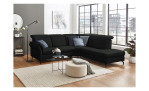 Komfort-Ecksofa vito Sardena, in der Farbausführung Schwarz, mit Kissen, in einem Raum stehend