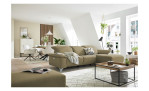Komfort - Ecksofa Musterring MR 370, in der Farbausführung taupe mit einem Hocker, in einem Raum stehend