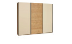 Basis-Schwebetürenschrank Musterring Montino mit einem Korpus in Balkeneiche und einer Front in Sand / Balkeneiche.