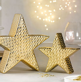 Zwei goldene Sterne aus Keramik